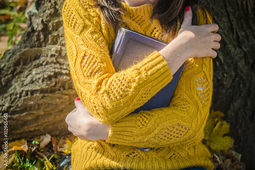 Woman hands hug the book