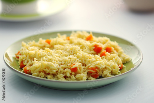 Stewed rice with a carrot on a , close up