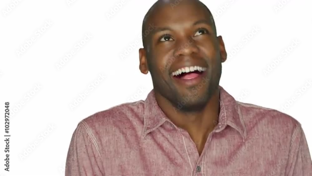 Handsome young man laughs, on a white studio background Handsome young man laughs, on a white studio background