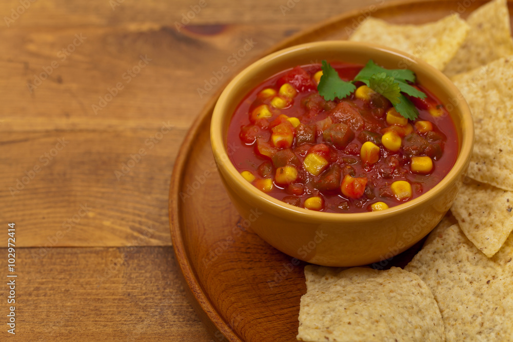 Salsa with Corn and tortilla chips. Selective focus. Salsa with Corn and tortilla chips. Selective focus.