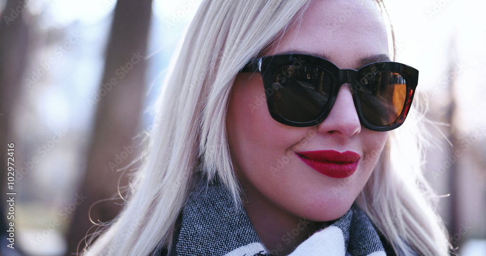 Beautiful blonde woman smiling to the camera Beautiful blonde woman smiling to the camera