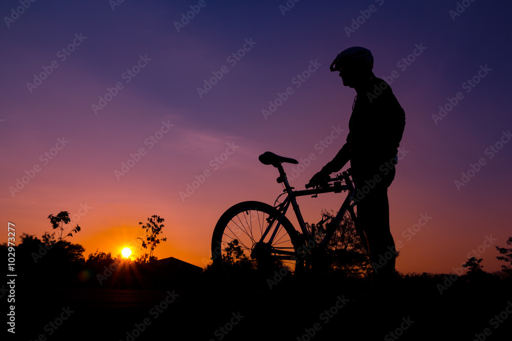 Fototapeta premium A silhouette of biker at sunset