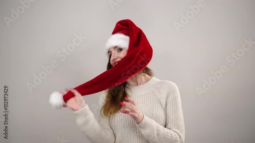 Woman playing with santa claus helper hat 4K.