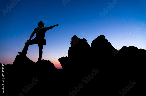 Silhouette of the person and sunset gradient background. Active sport and business goal life.