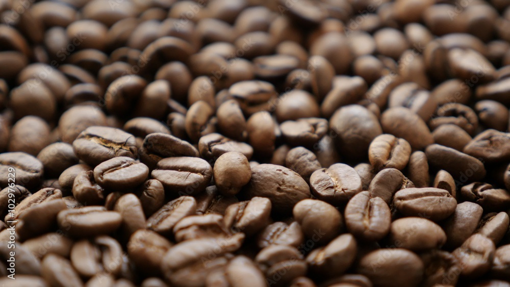 Coffee beans roasted and ready to grind slow tilting 4K 2160p UltraHD footage - Background made of coffee beans slow tilt 4K 3840X2160 UHD video Coffee beans roasted and ready to grind slow tilting 4K 2160p UltraHD footage - Background made of coffee beans slow tilt 4K 3840X2160 UHD video
