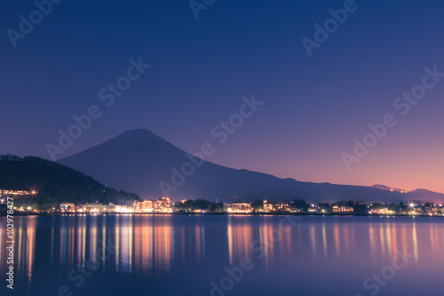 Night scene of Mt fuji and the city around kawaguchi lake, japan