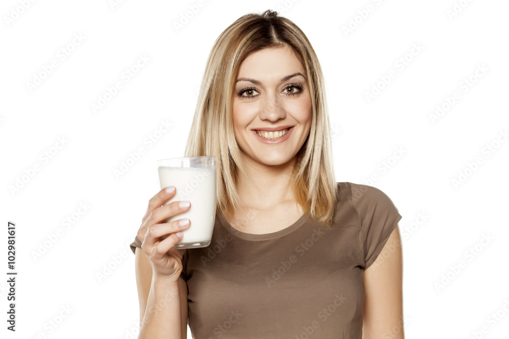 happy young woman hold a glass of milk happy young woman hold a glass of milk