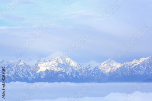 beautiful fog among frozen mountain summits landscape