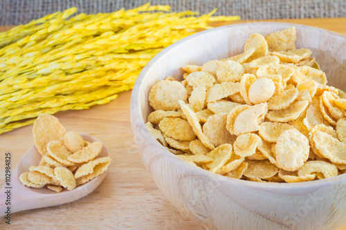 cornflakes and yellow rice with sack or tablecloth background