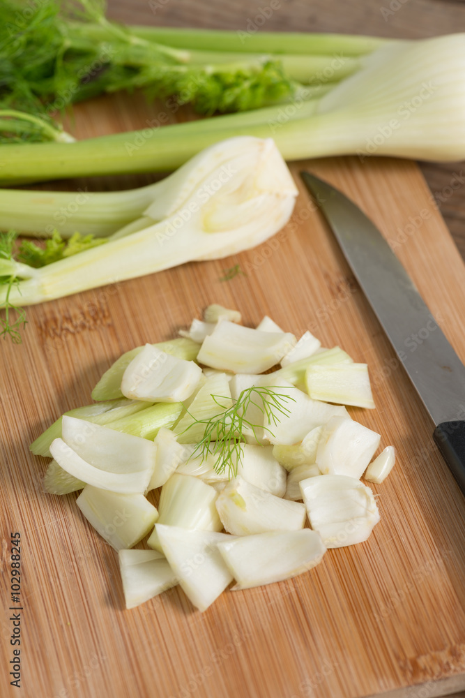 Fennel on wood cutting board. Fennel on wood cutting board.