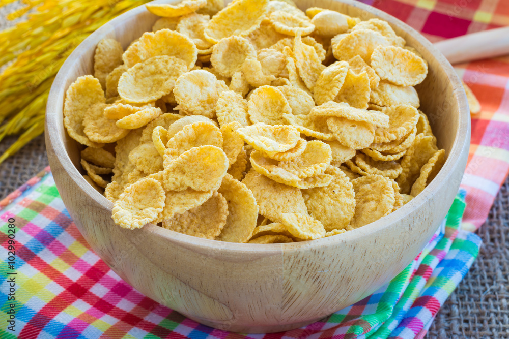 cornflakes and yellow rice with sack or tablecloth background cornflakes and yellow rice with sack or tablecloth background