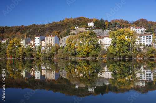 Reflection of modern french houses in the river in Europe