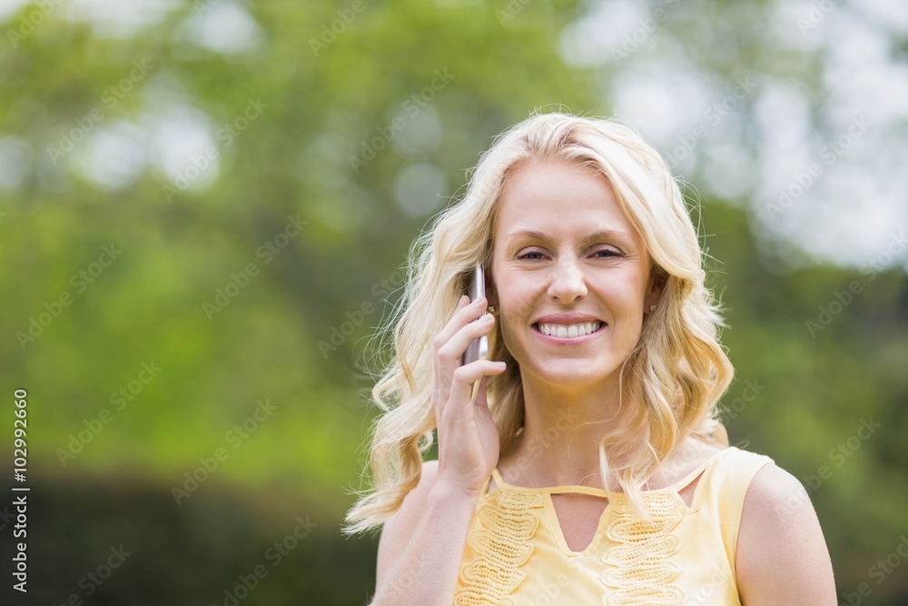 Happy woman making a phone call Happy woman making a phone call