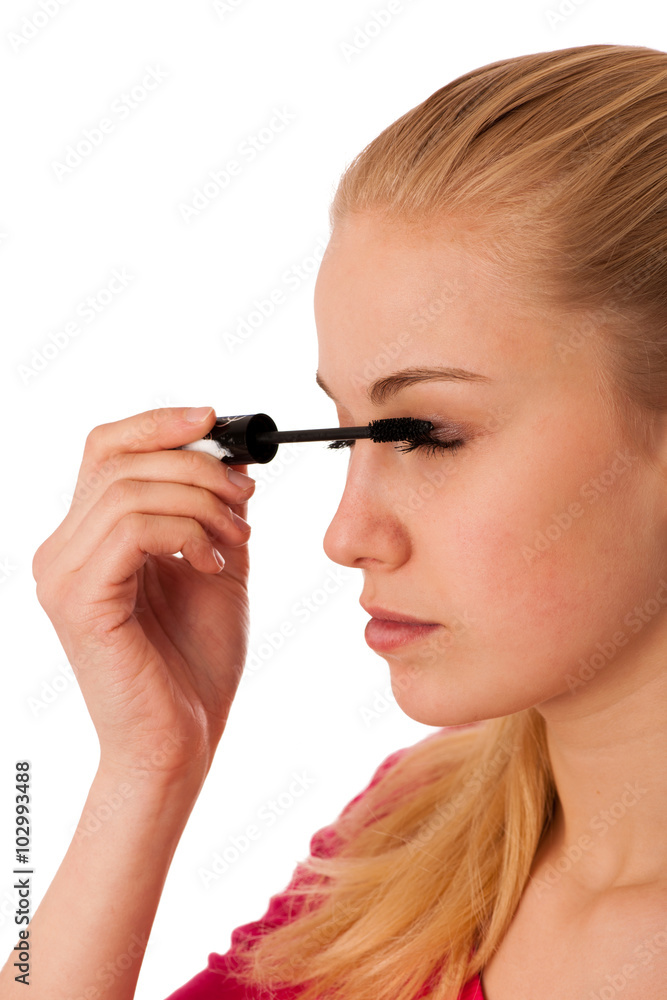 Woman applying black mascara on eyelashes, doing makeup. Woman applying black mascara on eyelashes, doing makeup.