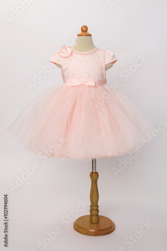 baby pink dress on a mannequin