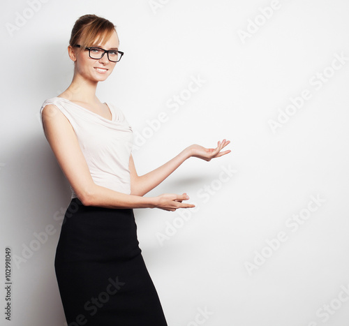  young business woman shows something