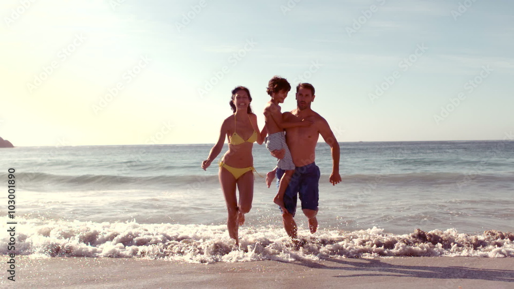 Happy family running in water Happy family running in water