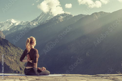 Wallpaper Mural Young girl doing yoga fitness exercise outdoor in beautiful mountains landscape