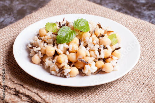 Warm salad with brown rice, chickpeas, wild rice and mint