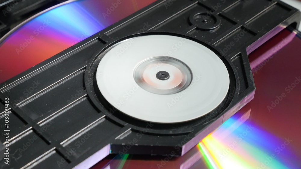Compact disc mechanism playing media content 4K 2160p UltraHD footage - DVD and CD player disc reading mechanism sequences 4K 3840X2160 UHD video Compact disc mechanism playing media content 4K 2160p UltraHD footage - DVD and CD player disc reading mechanism sequences 4K 3840X2160 UHD video