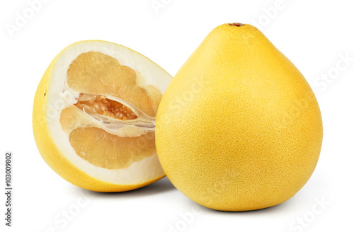 Ripe pear-shaped pomelo fruit and a half of pomelo isolated on white background. 