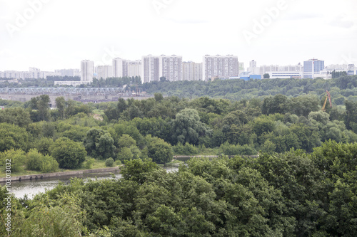 Top view of the field, city Park, big river and city on the horizon. Городской парк Коломенское. Москва река.