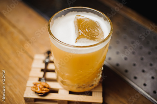 whiskey cocktail and natural ice on bar
