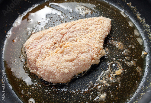 Chicken breast fillets fried in frying pan