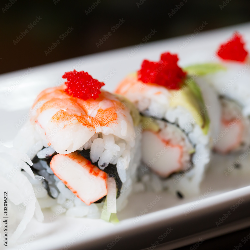 Sushi set, sushi roll with shrimp and sushi roll with avocado. Sushi set, sushi roll with shrimp and sushi roll with avocado.