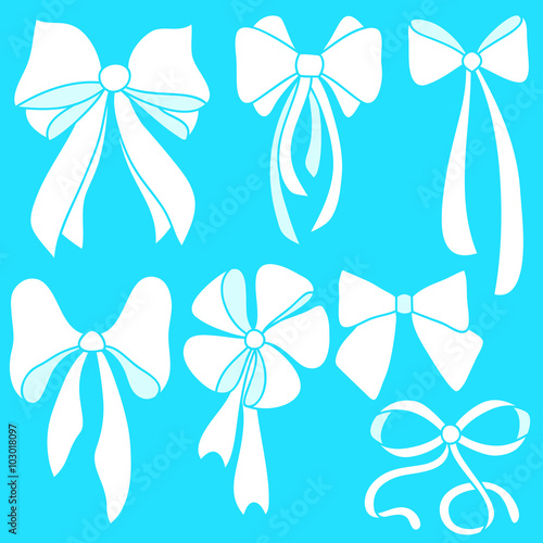 Set of white bows on blue background