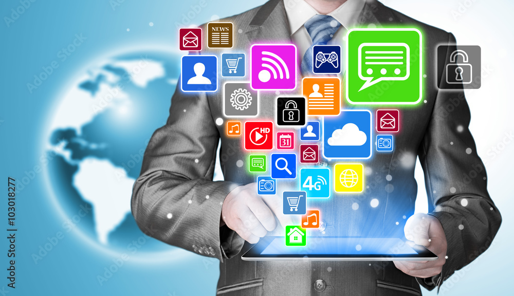 Obraz premium Business man using tablet PC with social media icon set