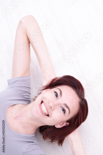 young happy woman lying