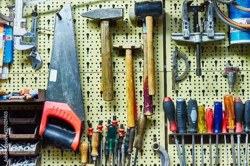 workbench with many tools / hammers, saws, screwdrivers and co photo