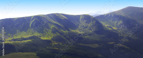 Green mountain ridge panorama, summer sunny day.