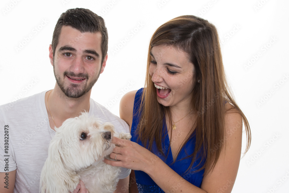 Couple in love with a white dog isolated on white Couple in love with a white dog isolated on white