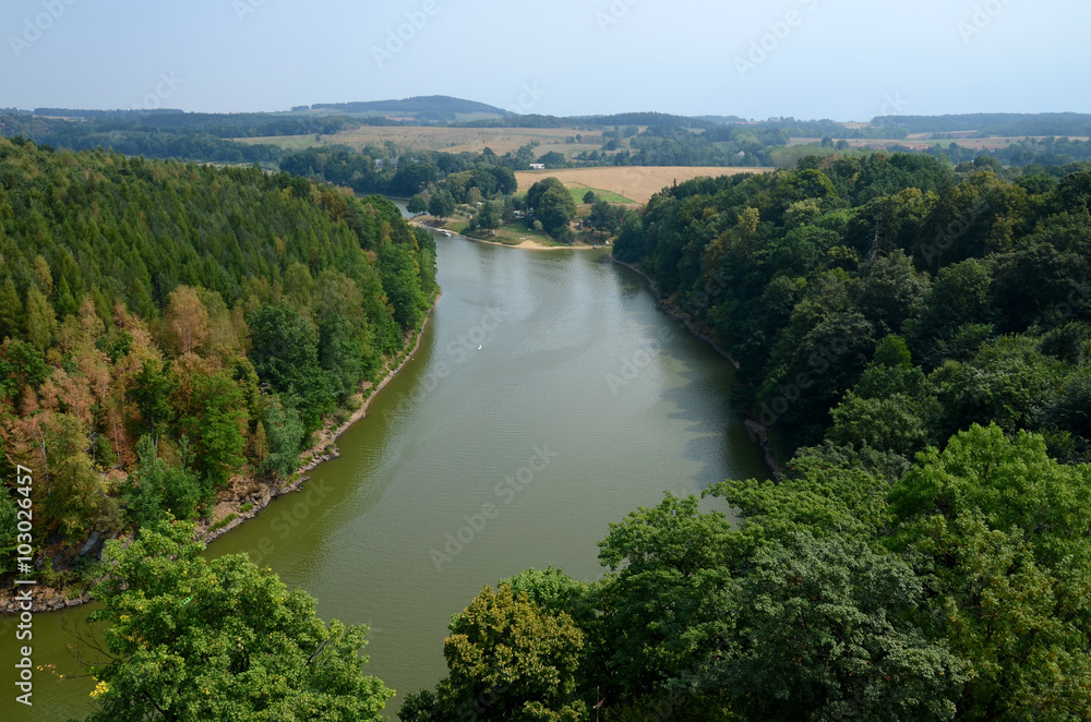 Landscape with a river flowing through the forest (Kwisa in Poland)