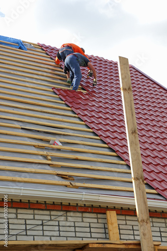Roofers on the roof