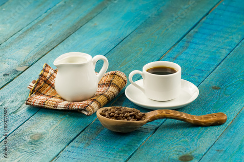 Set table for breakfast. Hot Cup of coffee on turquoise wooden background