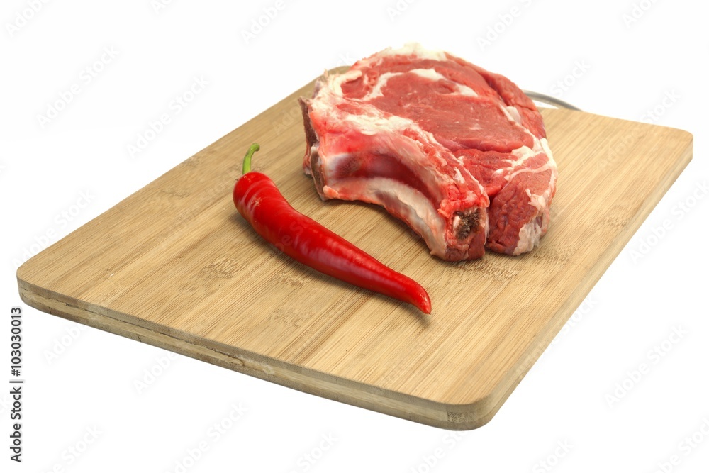 Raw Beef Steak, Pepper On The Wood Cutting Board Isolated Raw Beef Steak, Pepper On The Wood Cutting Board Isolated