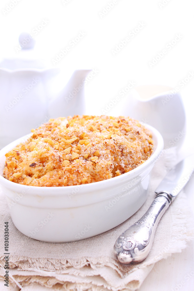 cake with apples, nuts and cinnamon on a white background cake with apples, nuts and cinnamon on a white background