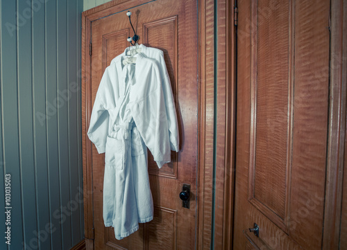 hanging white bathrobe