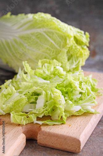 Chinese cabbage sliced on a wooden board
