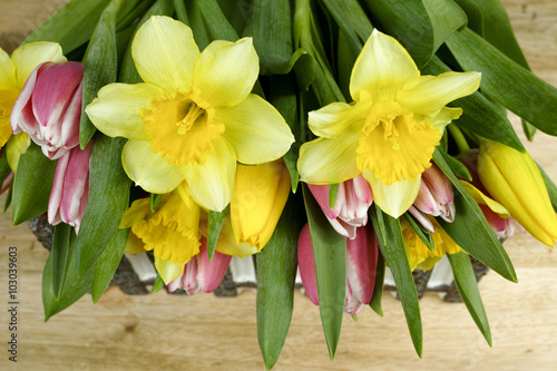 Fototapeta Naklejka Na Ścianę i Meble -  Multicolored bouquet spring flowers on wooden background