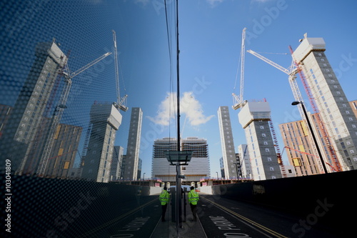 Canvas Print Tall buildings on a construction sitereflected on glass in Wembley, London