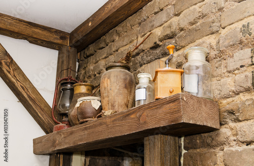 Old pottery and glass flasks with a kerosene lamp
