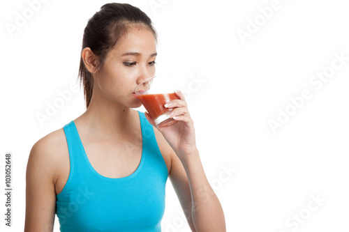 Beautiful healthy Asian girl  drink  tomato juice