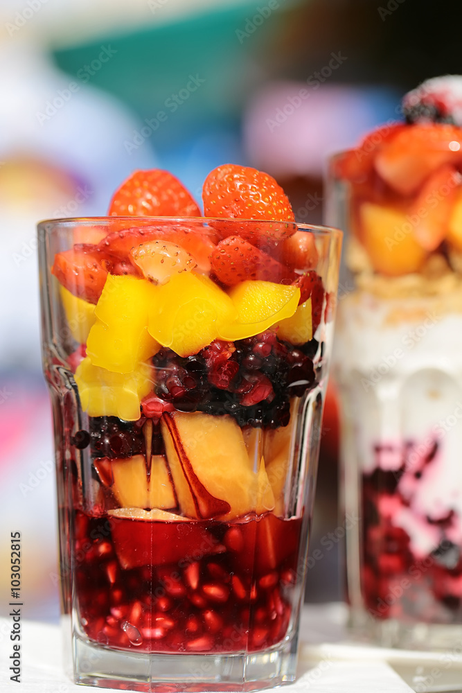 Two glassed with fruit salads Two glassed with fruit salads