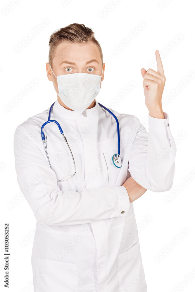 Young  male doctor in white coat and stethoscope finger point up