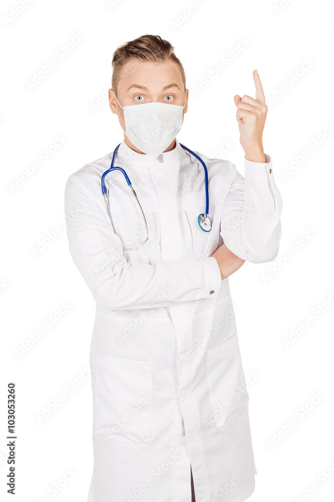 Young male doctor in white coat and stethoscope finger point up Young male doctor in white coat and stethoscope finger point up