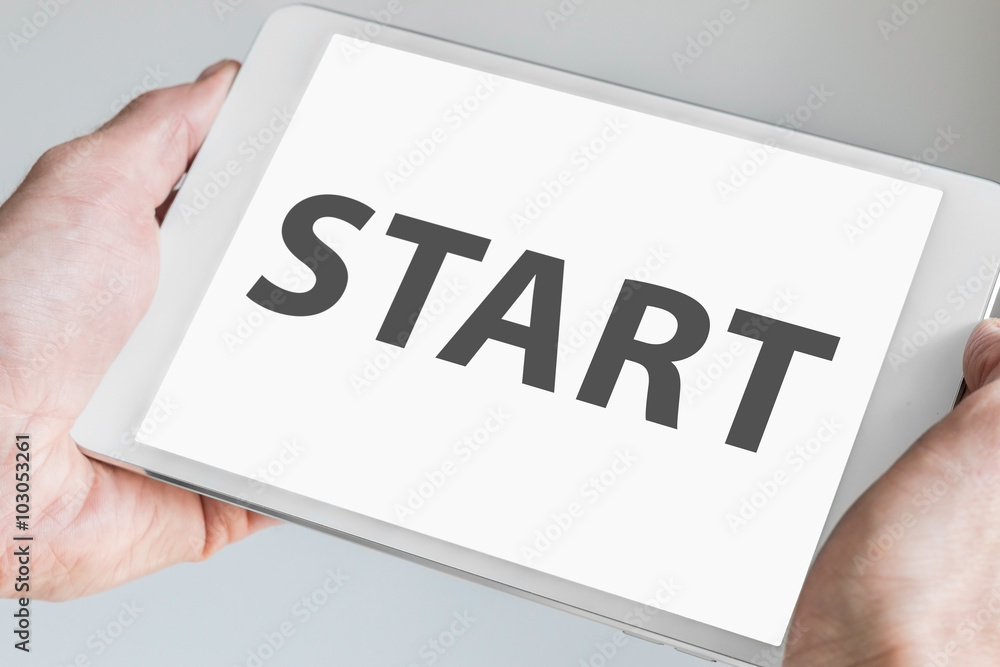 Start text displayed on modern tablet or mobile device as background with touch screen Start text displayed on modern tablet or mobile device as background with touch screen